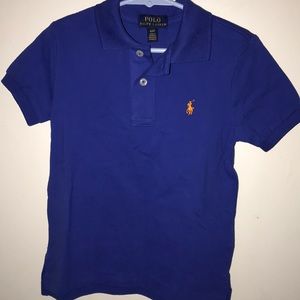 A blue button up short sleeve collared shirt
